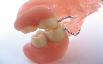 How to keep food from getting under your dentures?